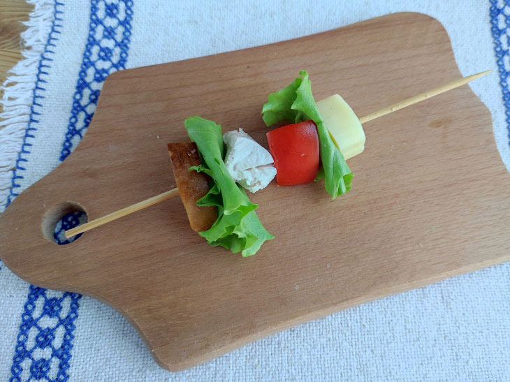 Caesar salad on skewers - a popular dish with an unusual serving