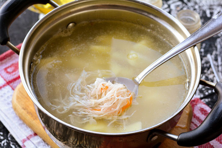 Kapustnyak soup with chicken and sauerkraut is a hearty meal for the whole family