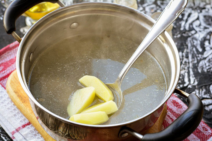 Kapustnyak soup with chicken and sauerkraut is a hearty meal for the whole family