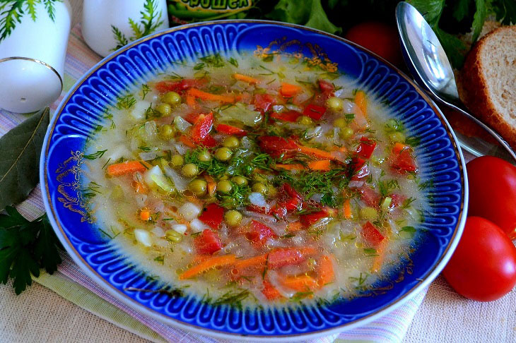 Summer fragrant soup with young cabbage and green peas