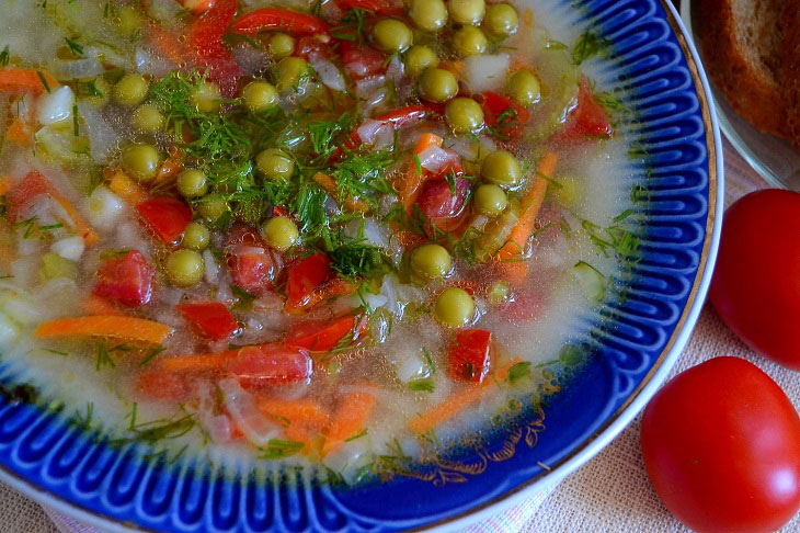 Summer fragrant soup with young cabbage and green peas