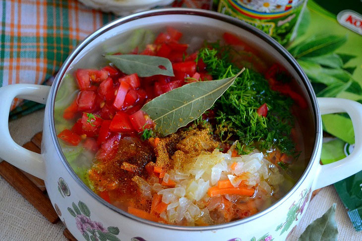 Summer fragrant soup with young cabbage and green peas