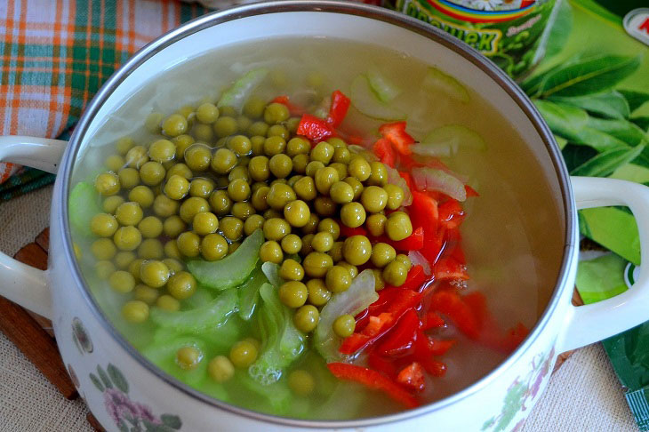 Summer fragrant soup with young cabbage and green peas