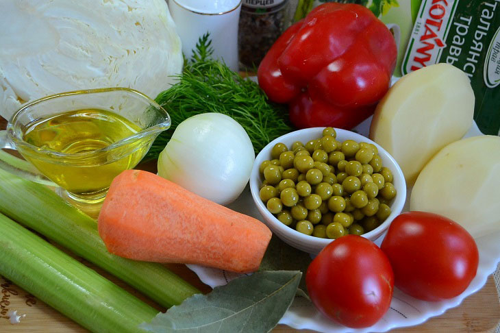 Summer fragrant soup with young cabbage and green peas