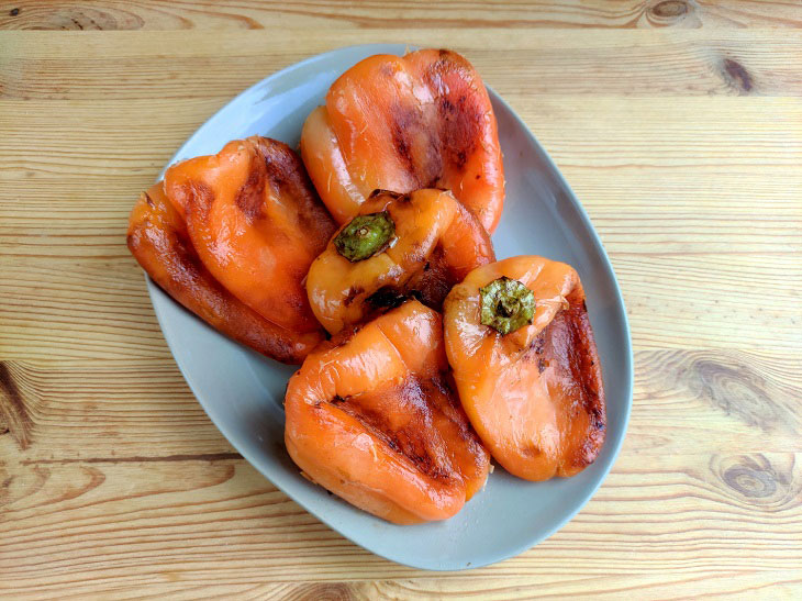 Fried peppers in a pan - a fragrant and spicy snack