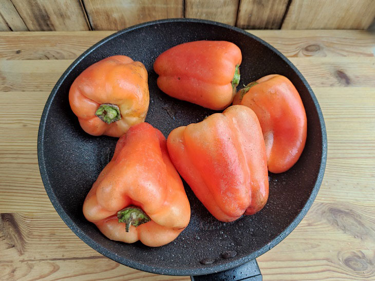 Fried peppers in a pan - a fragrant and spicy snack