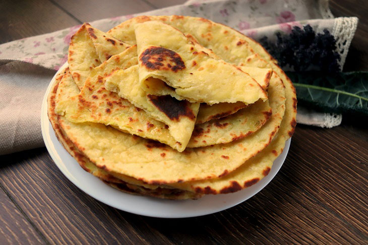 Potato cakes with cheese in a pan - tasty and fragrant