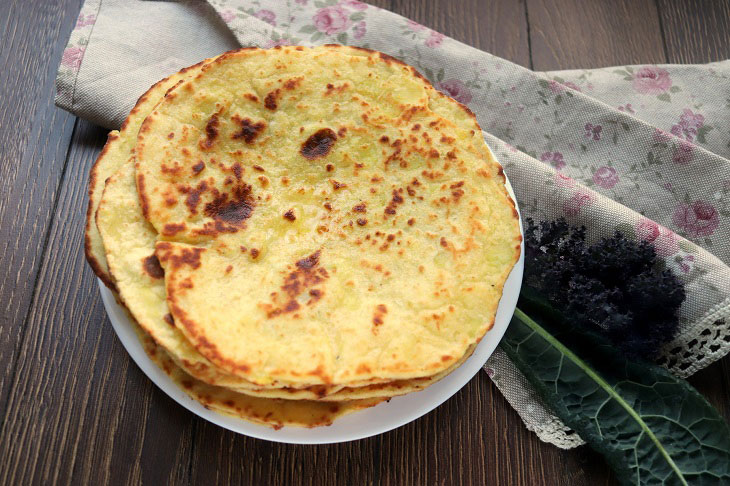 Potato cakes with cheese in a pan - tasty and fragrant