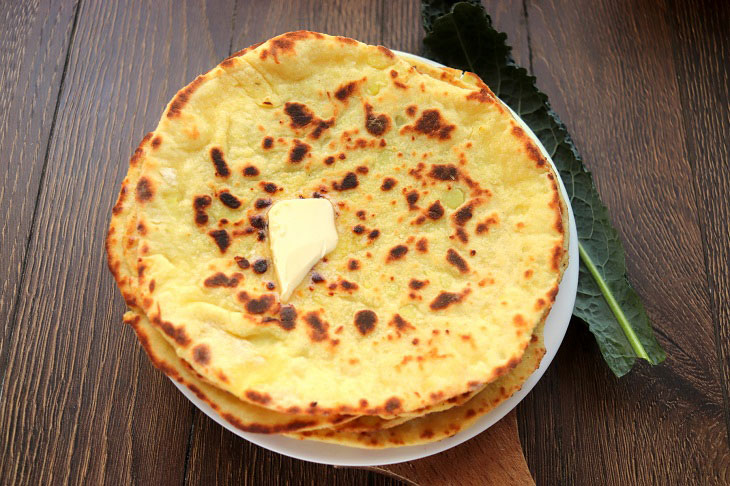 Potato cakes with cheese in a pan - tasty and fragrant