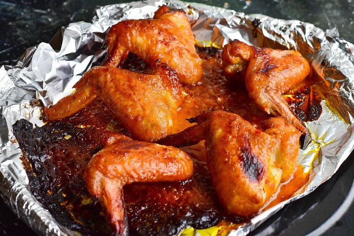 Chicken wings in adjika in the oven - delicious, quick and easy