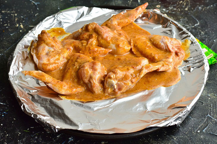 Chicken wings in adjika in the oven - delicious, quick and easy