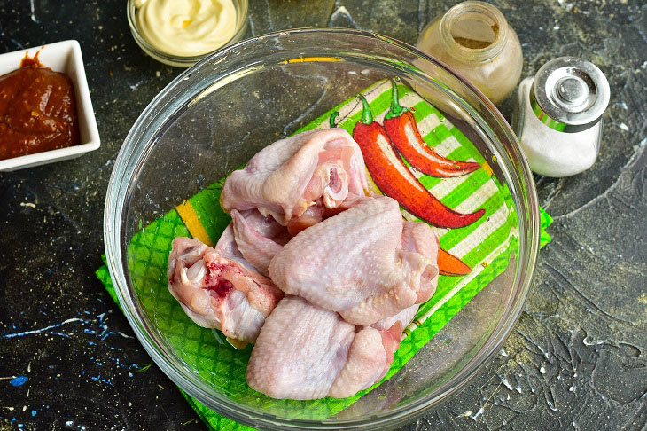 Chicken wings in adjika in the oven - delicious, quick and easy