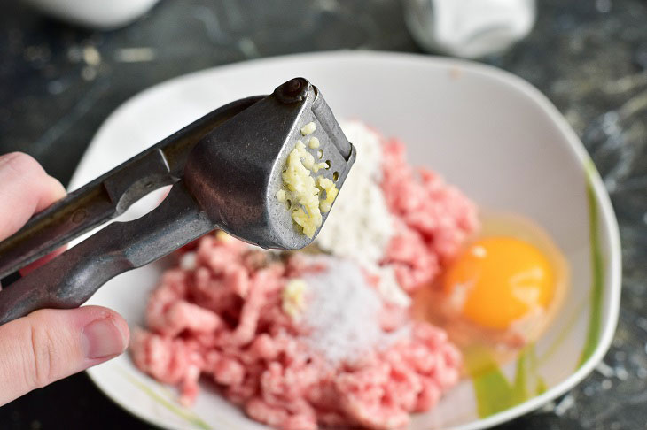 Fried meat sausages in a pan - juicy and fragrant