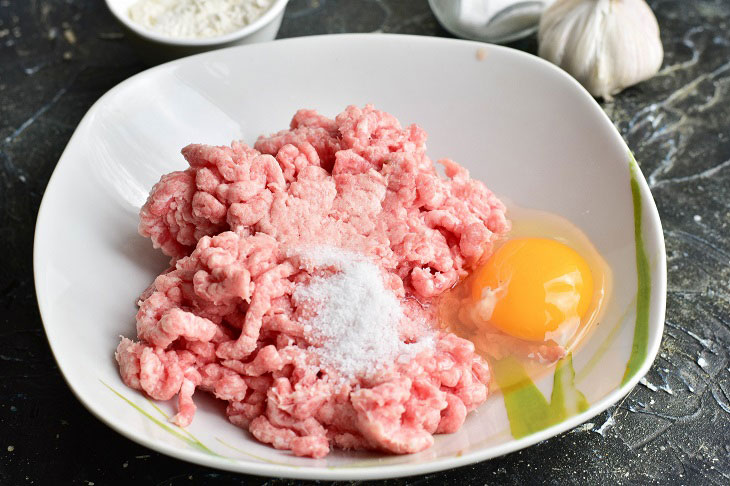 Fried meat sausages in a pan - juicy and fragrant