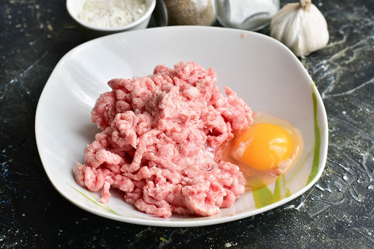 Fried meat sausages in a pan - juicy and fragrant