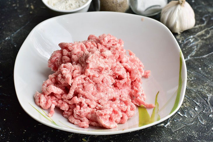 Fried meat sausages in a pan - juicy and fragrant