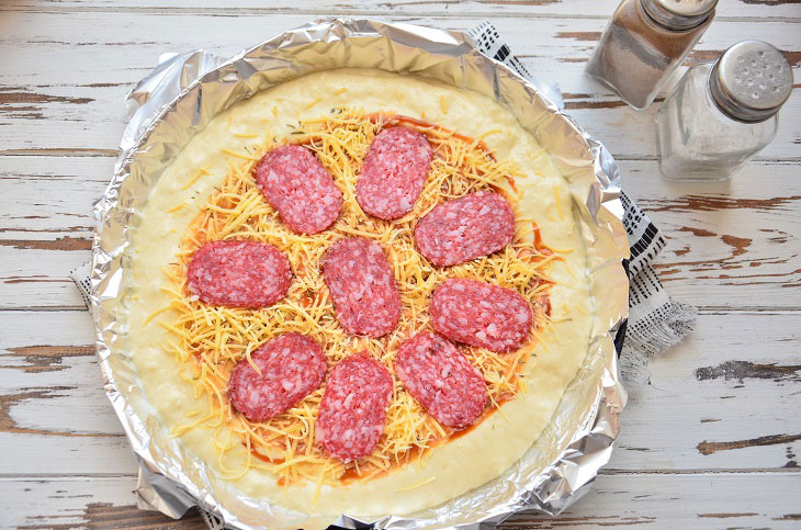 Kefir pizza with sausage in the oven - a delicious express recipe