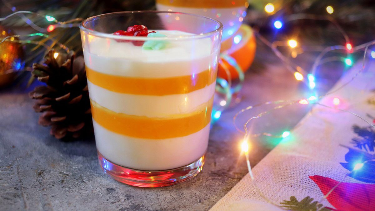 Festive dessert with an orange in a glass – light, delicate and airy
