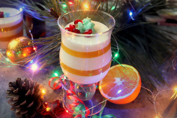 Festive dessert with an orange in a glass - light, delicate and airy