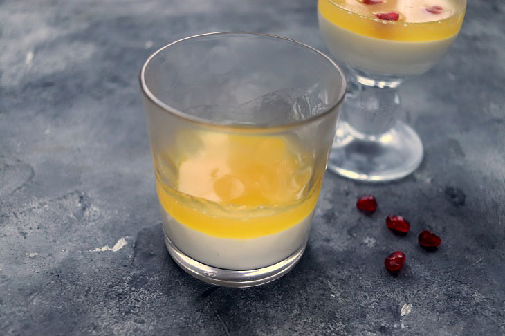 Festive dessert with an orange in a glass - light, delicate and airy