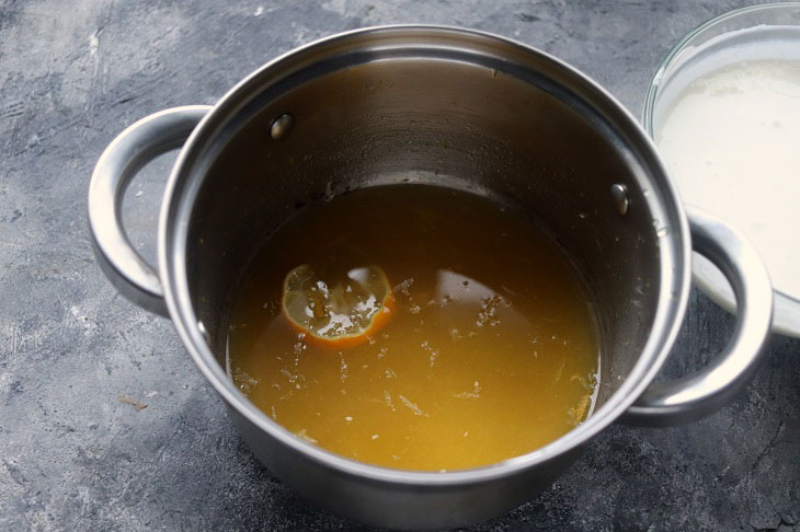 Festive dessert with an orange in a glass - light, delicate and airy