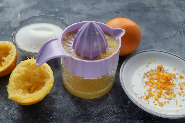 Festive dessert with an orange in a glass - light, delicate and airy