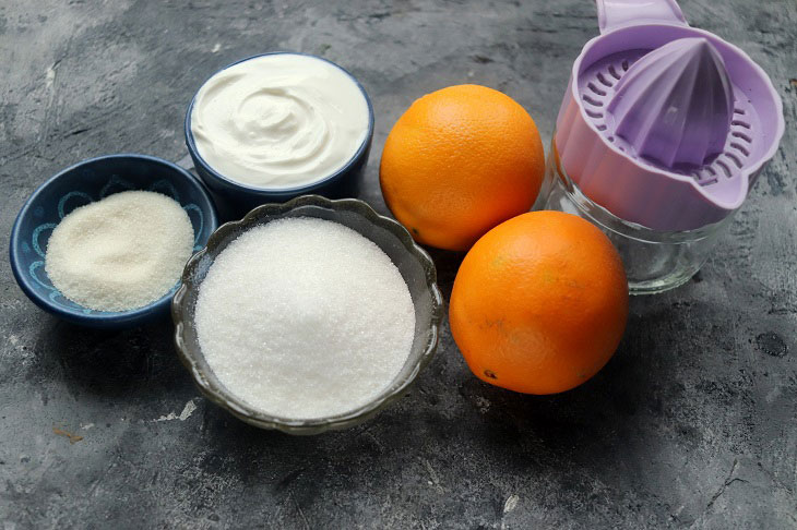 Festive dessert with an orange in a glass - light, delicate and airy