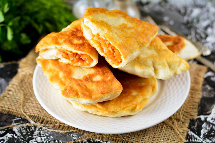 Homemade Gagauz pies with cabbage in a pan - lush and airy