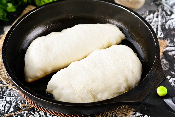 Homemade Gagauz pies with cabbage in a pan - lush and airy