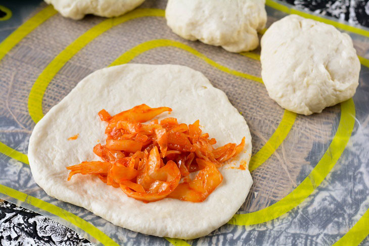 Homemade Gagauz pies with cabbage in a pan - lush and airy