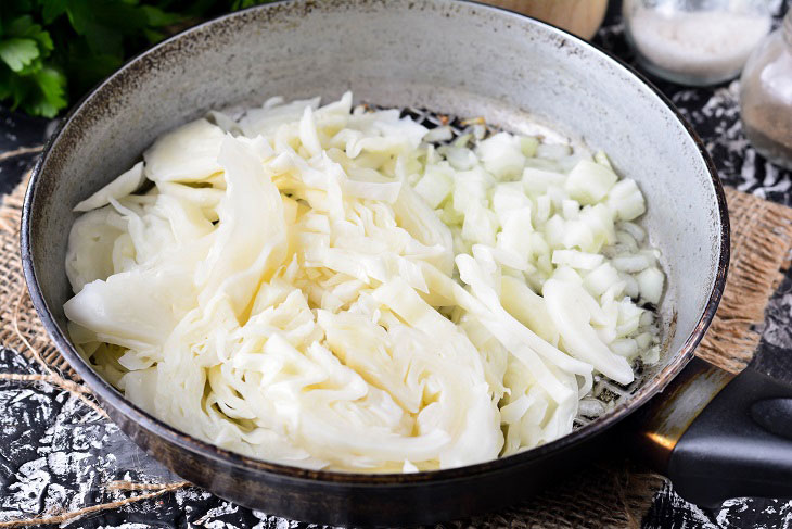 Homemade Gagauz pies with cabbage in a pan - lush and airy