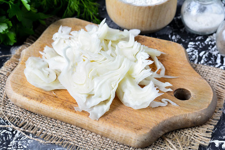 Homemade Gagauz pies with cabbage in a pan - lush and airy