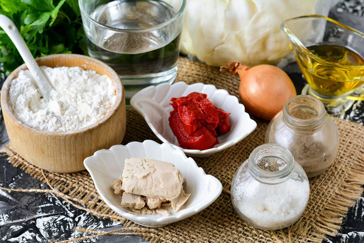 Homemade Gagauz pies with cabbage in a pan - lush and airy