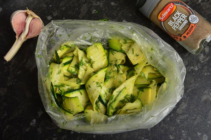 Lightly salted zucchini in a bag with garlic - a quick and easy snack