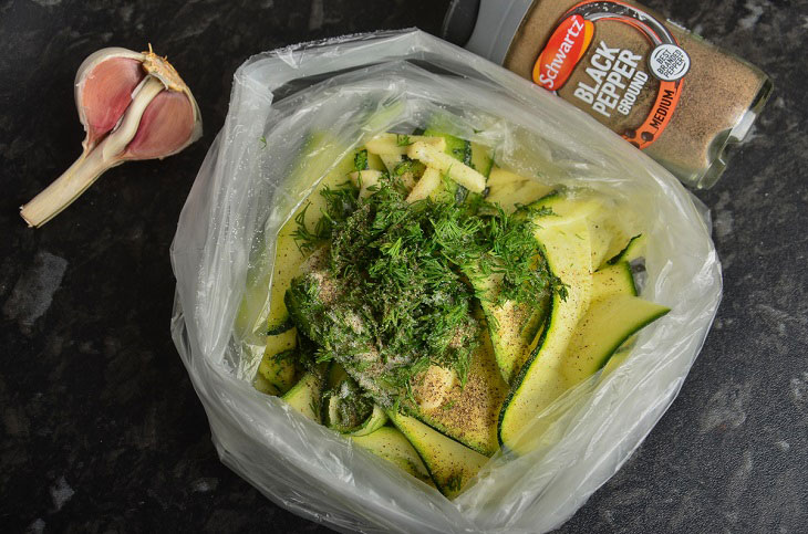 Lightly salted zucchini in a bag with garlic - a quick and easy snack