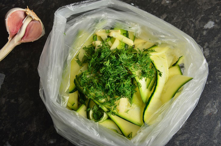 Lightly salted zucchini in a bag with garlic - a quick and easy snack