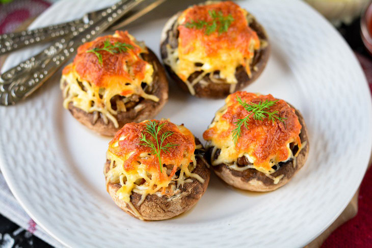Baked mushrooms with cheese and chicken in the oven - a simple and elegant recipe