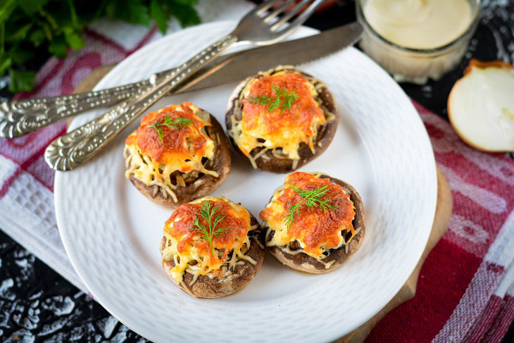 Baked mushrooms with cheese and chicken in the oven - a simple and elegant recipe