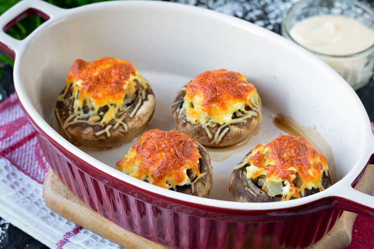 Baked mushrooms with cheese and chicken in the oven - a simple and elegant recipe