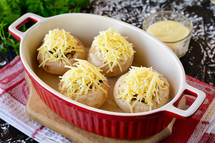 Baked mushrooms with cheese and chicken in the oven - a simple and elegant recipe