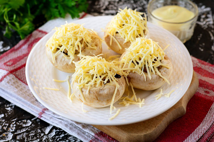 Baked mushrooms with cheese and chicken in the oven - a simple and elegant recipe