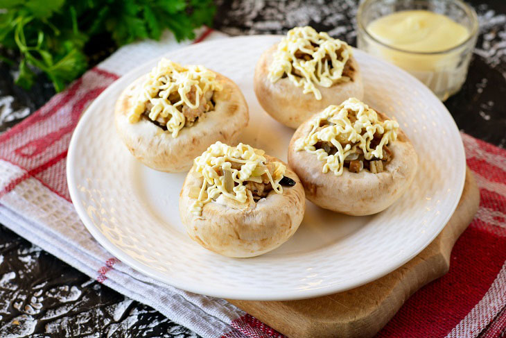 Baked mushrooms with cheese and chicken in the oven - a simple and elegant recipe