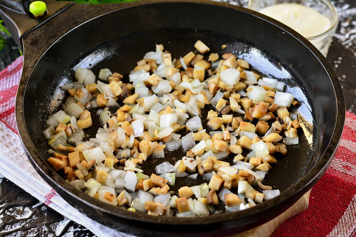 Baked mushrooms with cheese and chicken in the oven - a simple and elegant recipe