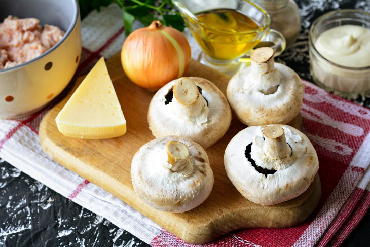 Baked mushrooms with cheese and chicken in the oven - a simple and elegant recipe