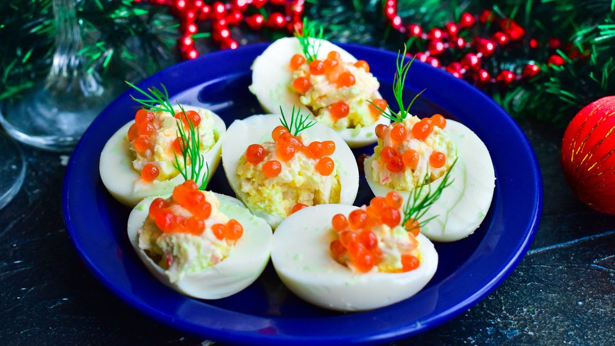 Stuffed eggs with red caviar – bright, beautiful and very tasty