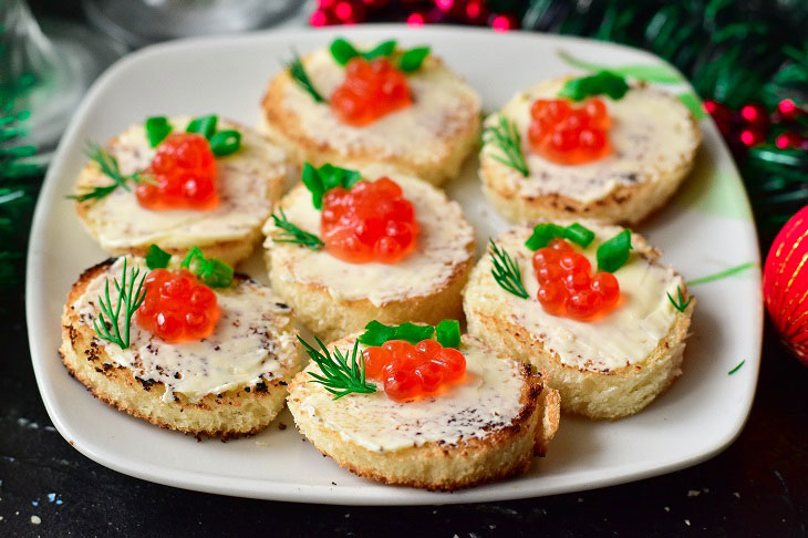 Canape with red caviar - a gourmet appetizer for the New Year