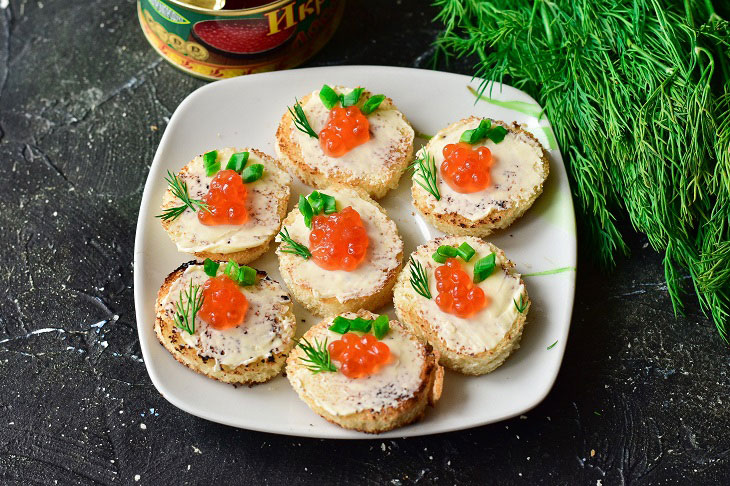Canape with red caviar - a gourmet appetizer for the New Year