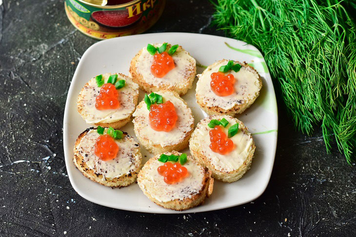 Canape with red caviar - a gourmet appetizer for the New Year