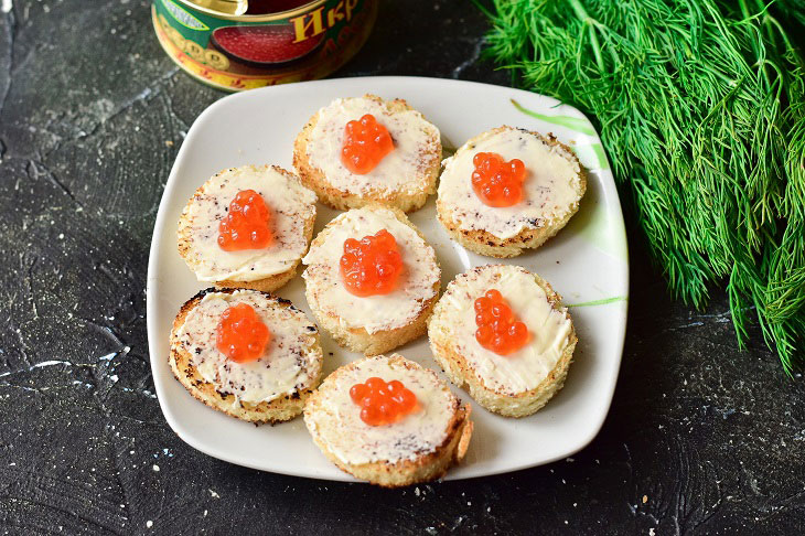 Canape with red caviar - a gourmet appetizer for the New Year