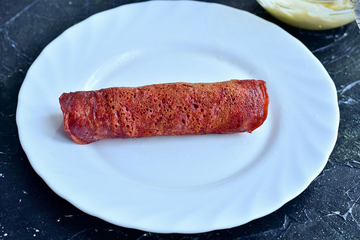 Rolls of beetroot pancakes - a wonderful snack on the festive table